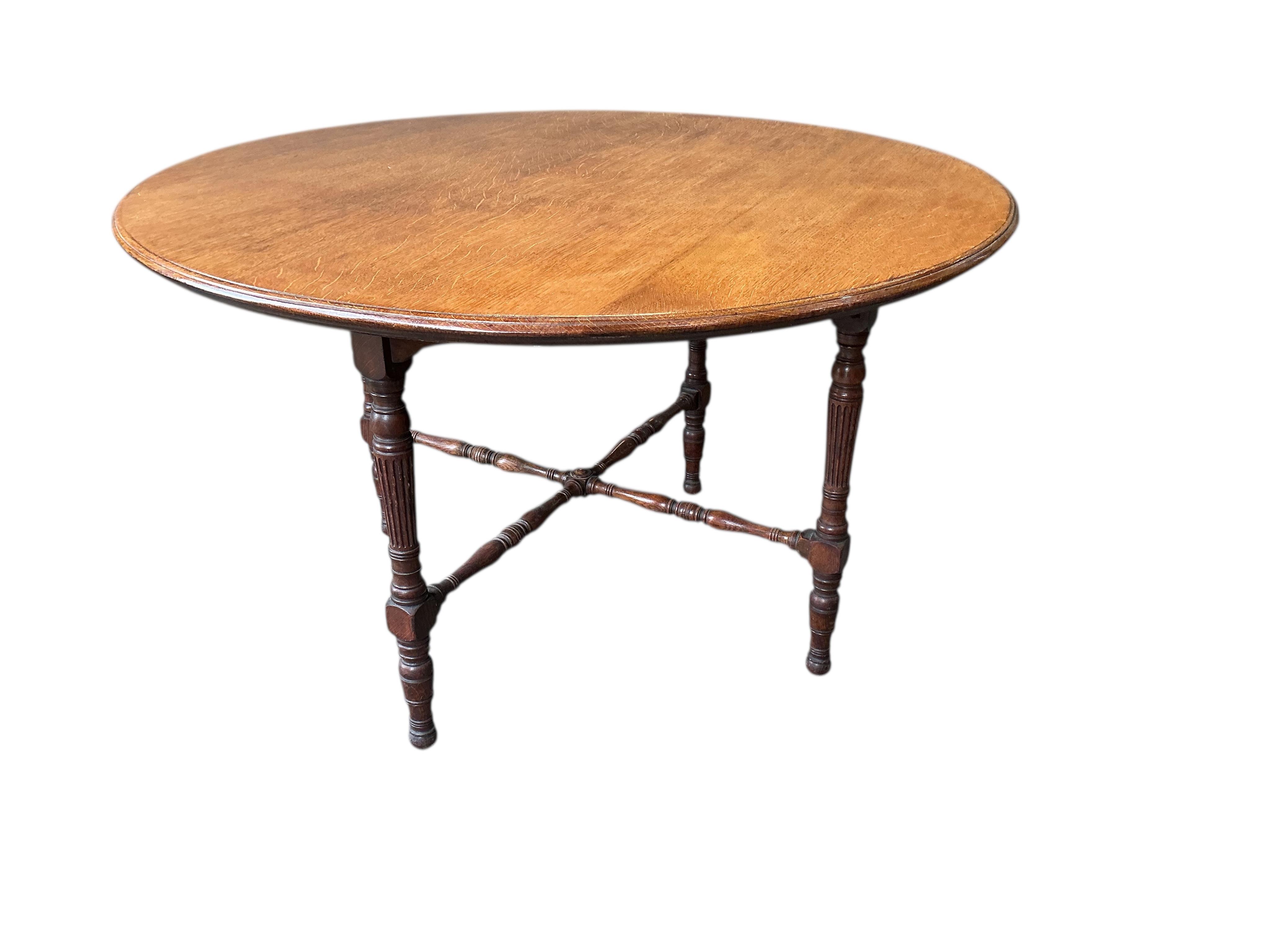 A late Victorian circular light oak breakfast table, diameter 120cm, height 72cm